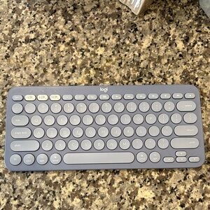 Blue Logitech Compact Wireless Keyboard